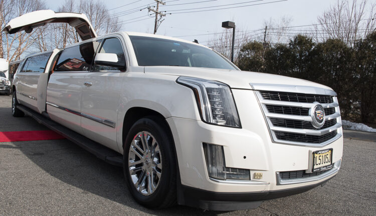 20 passenger Cadillac Escalade with jet door